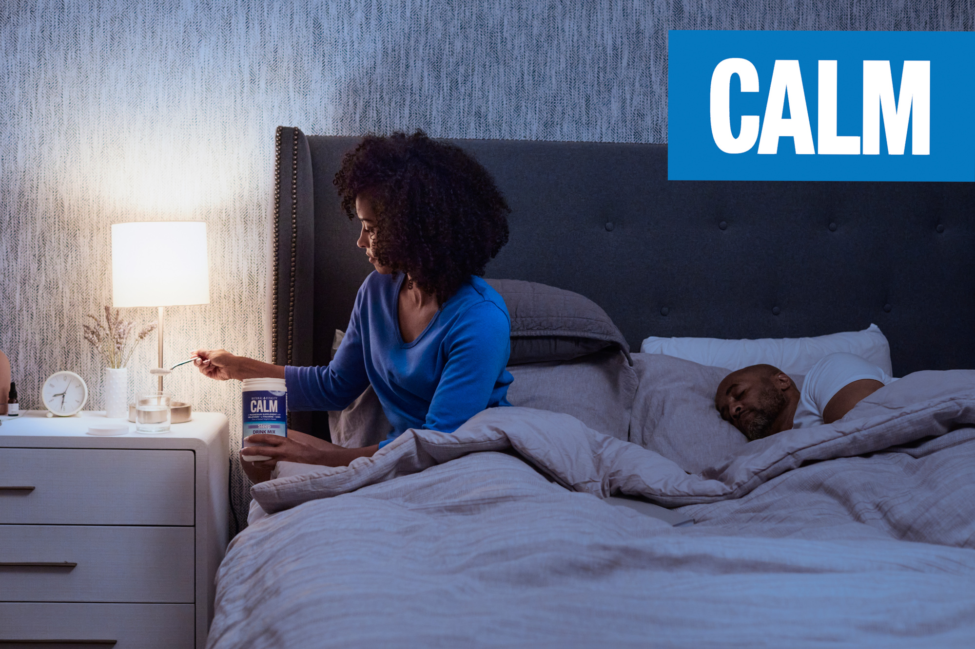 A couple takes supplements before bed in a Calm Ad Campaign photographed by Lifestyle Photographer Diana Mulvihill
