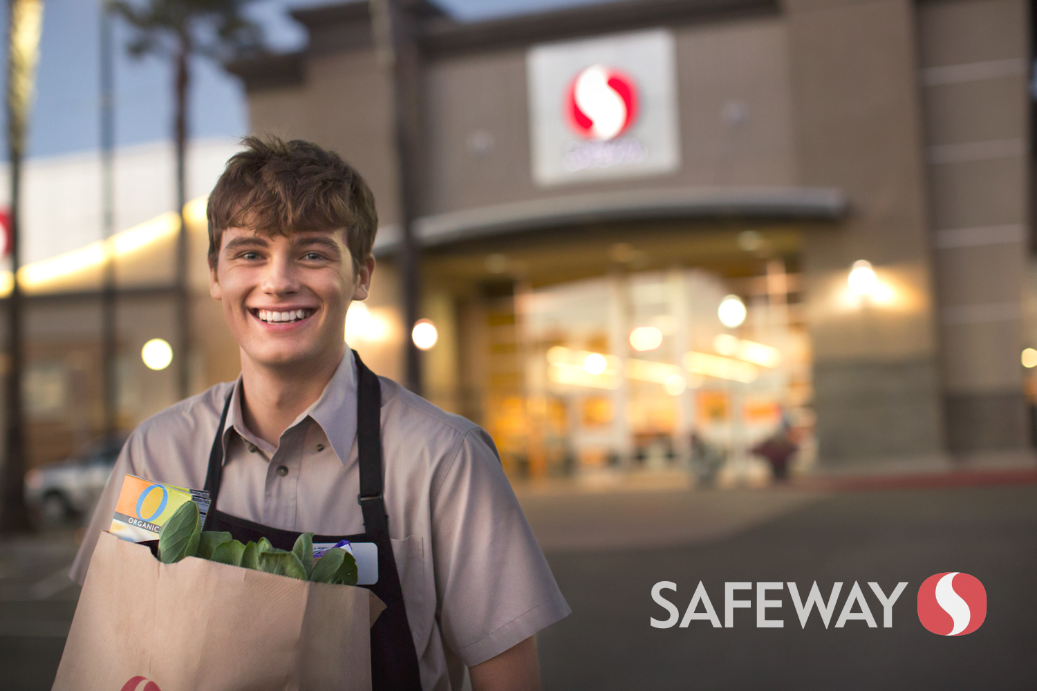 An employee carries groceries in a Safeway Ad Campaign photographed by Lifestyle Photographer Diana Mulvihill