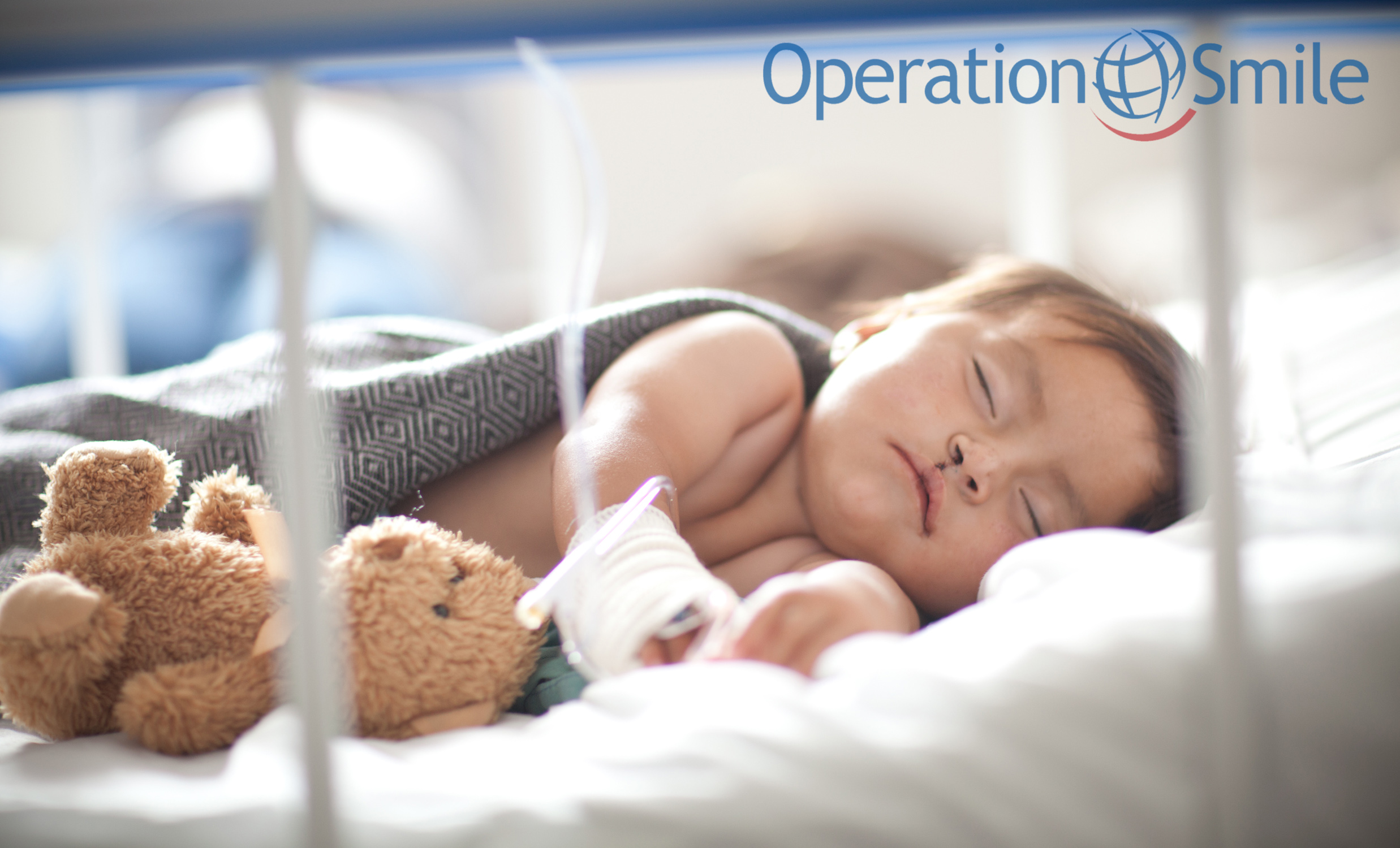 A baby recovers in a hospital bed after surgery in an Ad Campaign for Operation Smile photographed by Lifestyle Photographer Diana Mulvihill