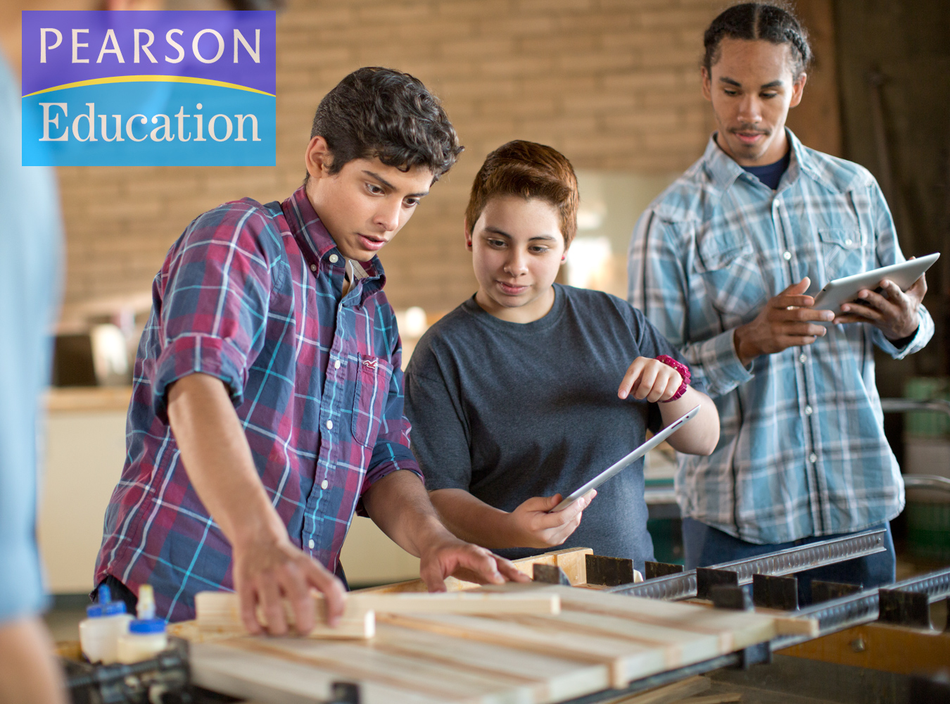 Teens work together in a wood shop in an Ad Campaign for Pearson Education photographed by Lifestyle Photographer Diana Mulvihill